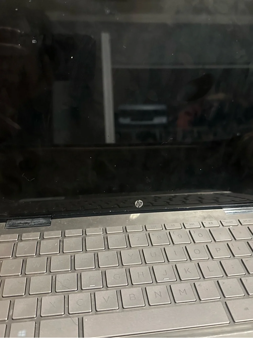 HP Silver Laptop with Charger and Sleek HP Logo